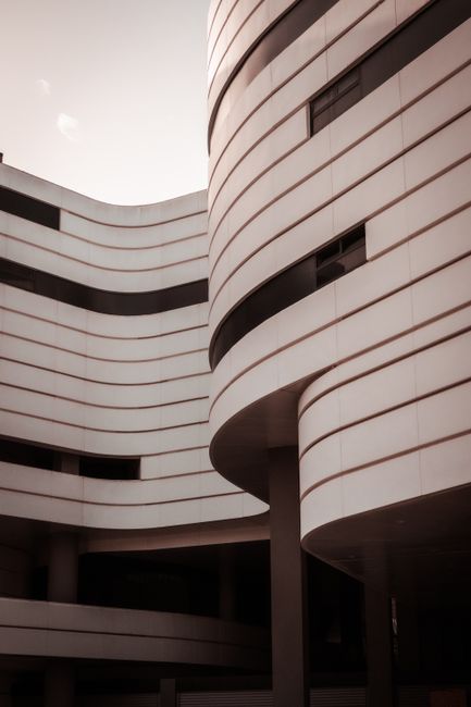 Captivating modern building facade with curved lines and sleek design.